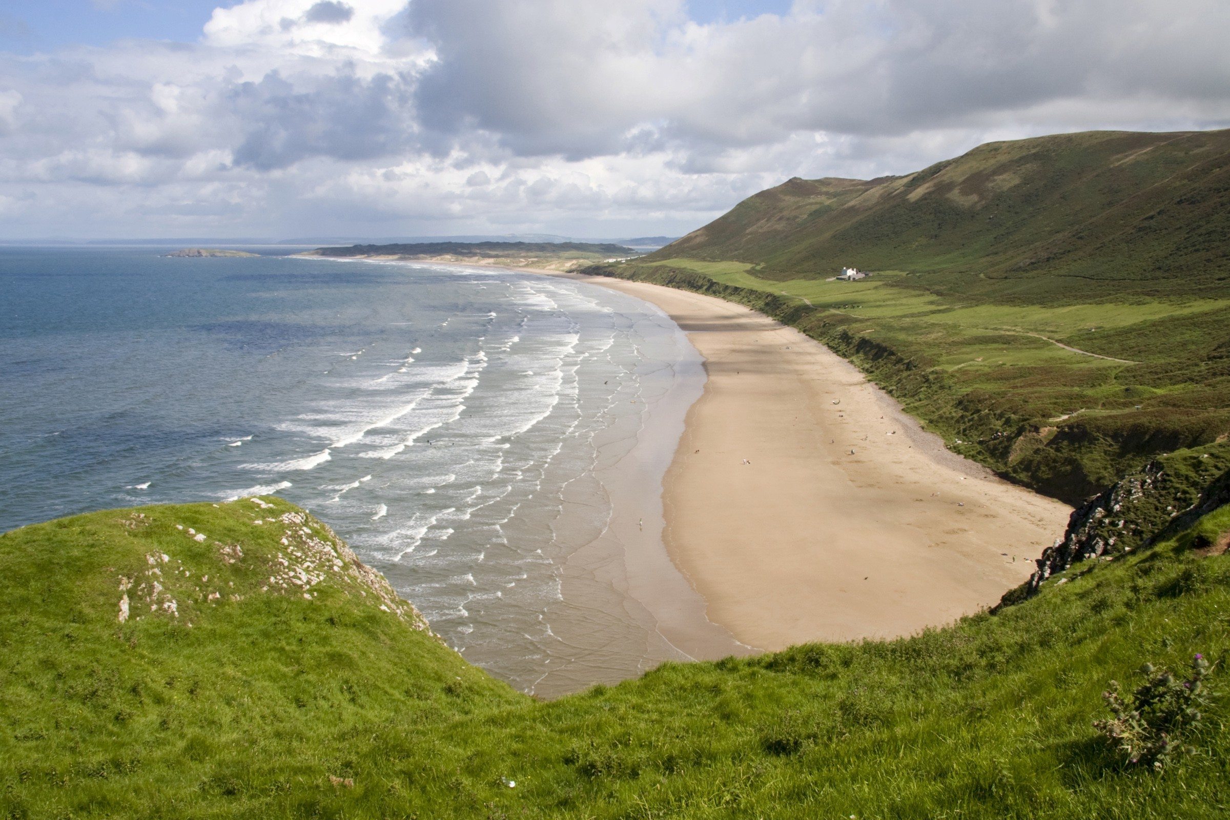 View across the Gower Peninsula coastline with cliffs, beaches and sea