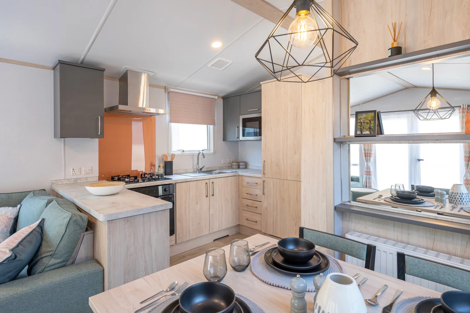 Static caravan on a holiday park with coastal views in the background