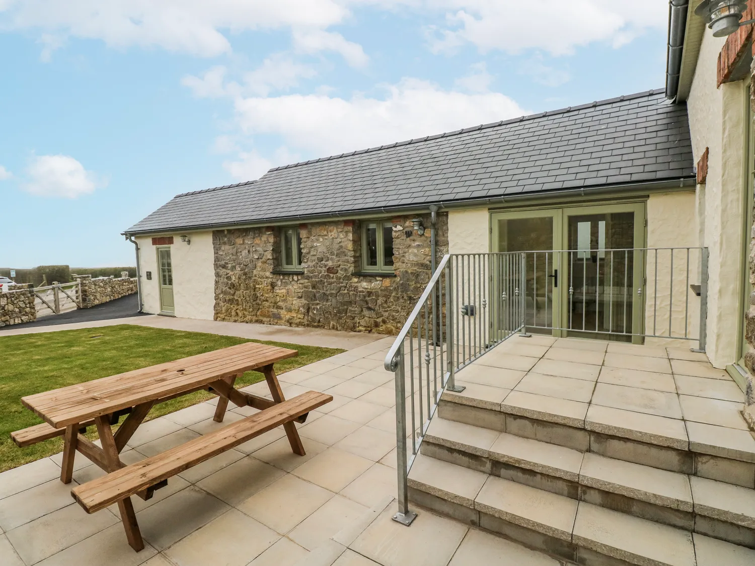 Scenic coastal view of Gower Peninsula with countryside and sea
