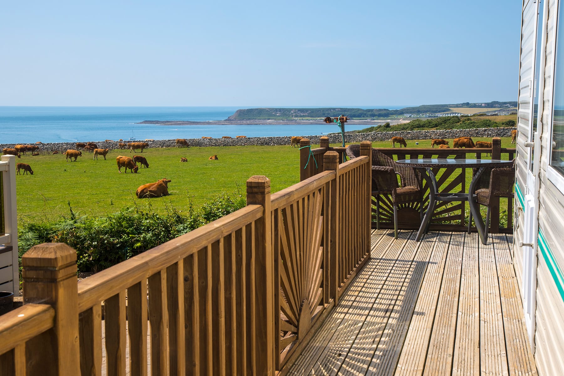 View from caravan decking at Green Meadow with Slade Bay in the background